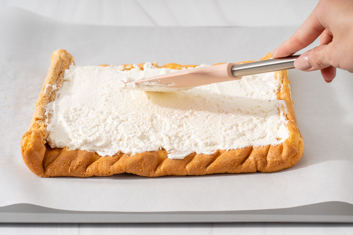 Step-6 Use a spatulia spreading the whipped cream